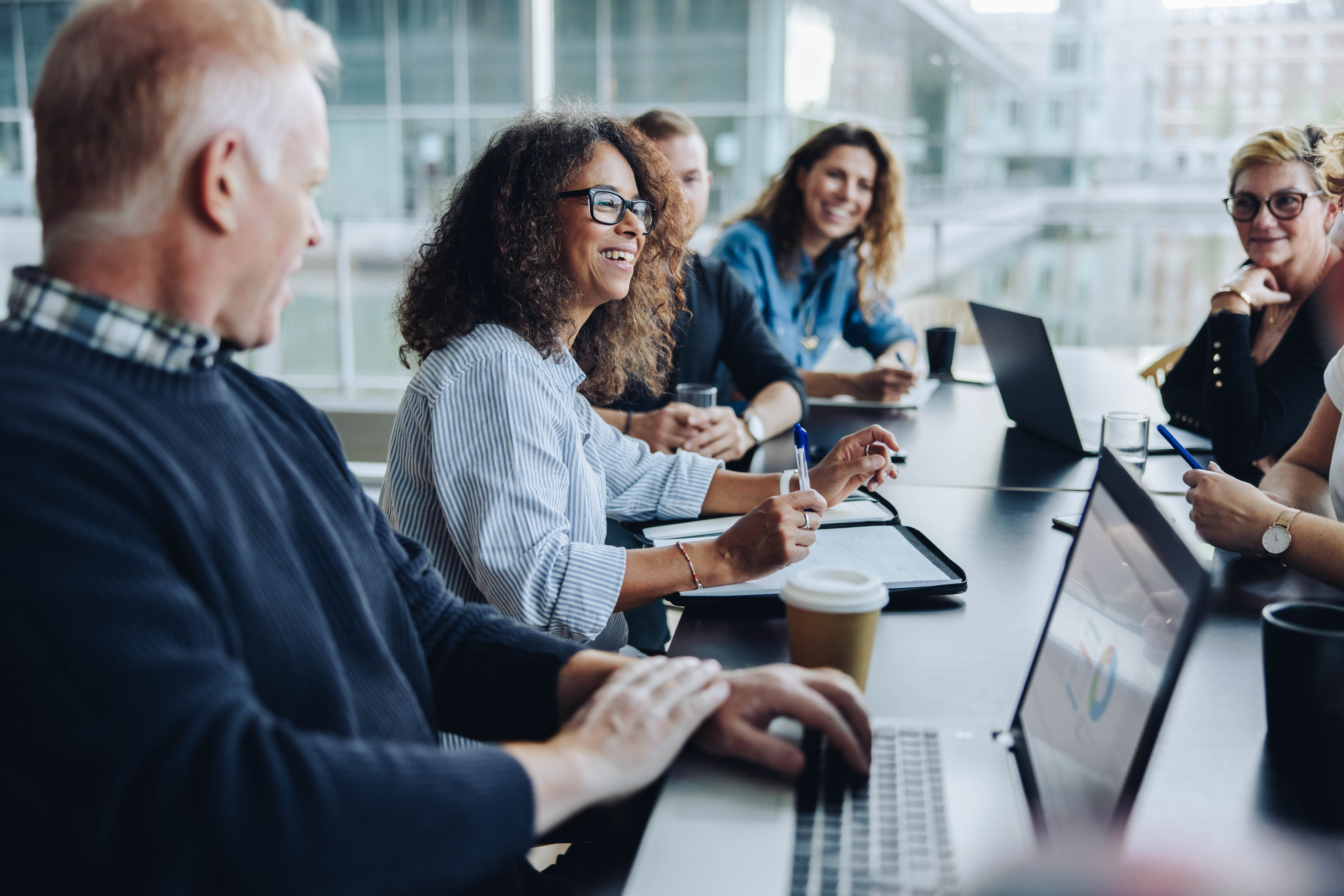 Leaders collaborating around a conference table during a training session